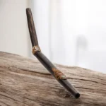 Tepi aus Chonta mit Medaillion 1